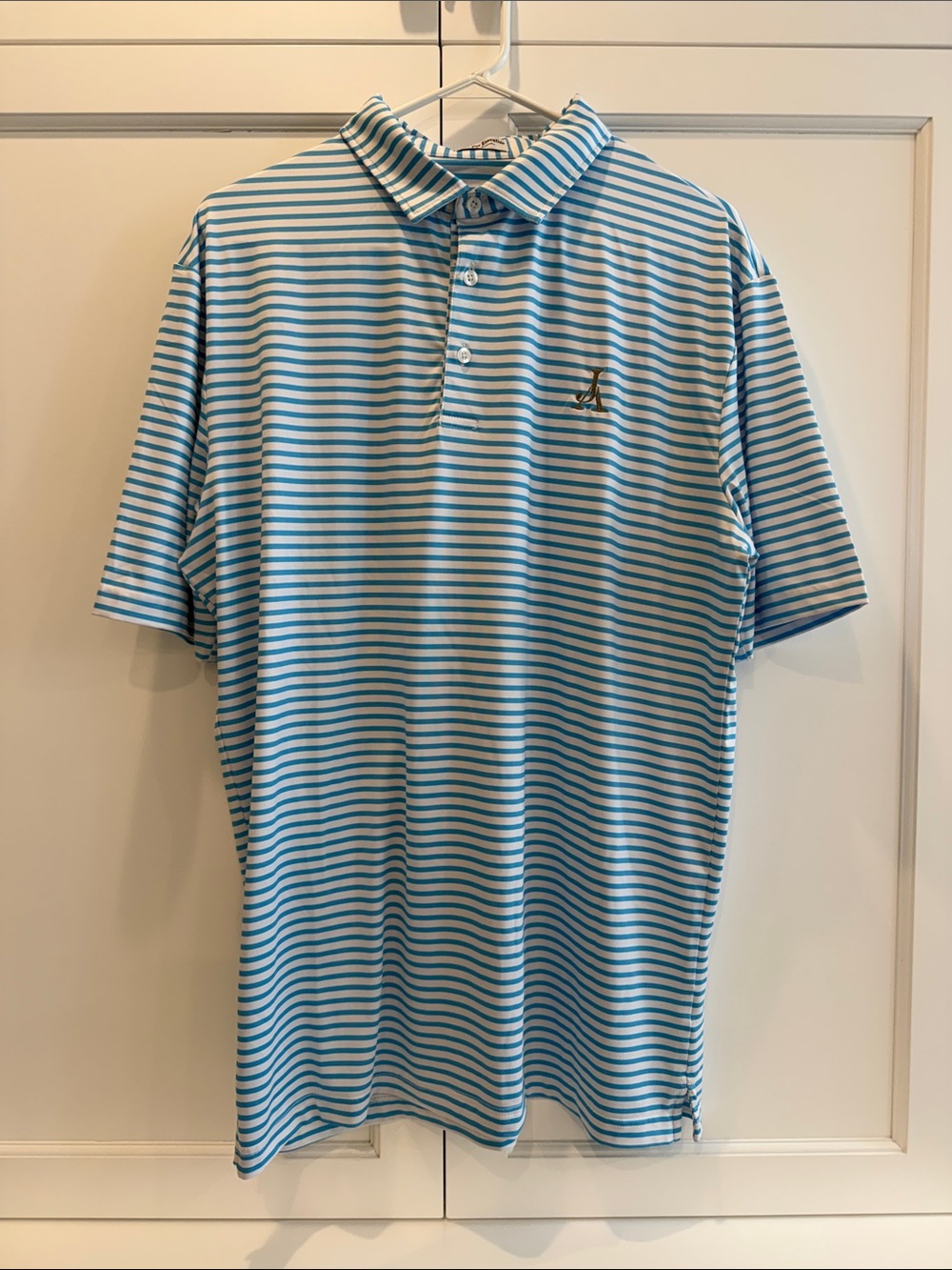 Men's Light Blue & White Striped Polo Shirt with Subtle Chest Logo